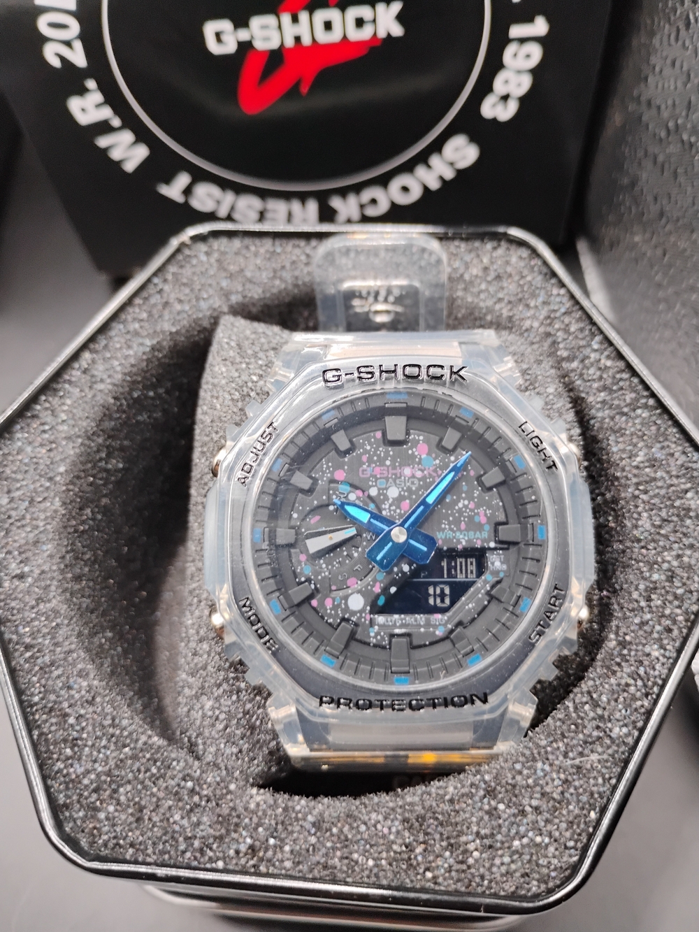 G-Shock Transparent Case with Blue Hands and Pink Accent Splatter